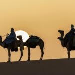 Camel riding in the heart of the desert